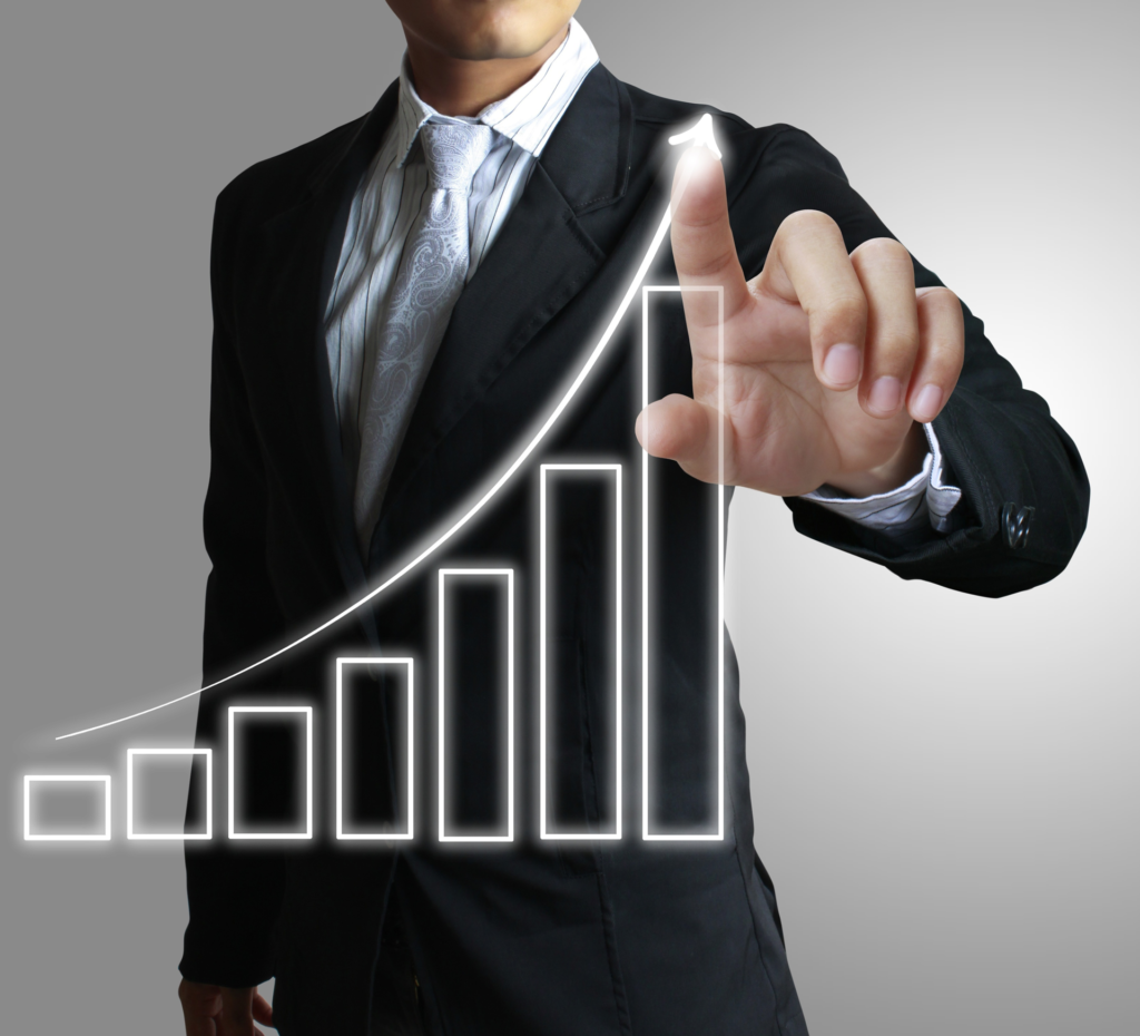 business man pointing at growth chart